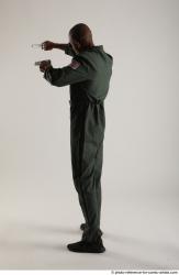 ERIC STANDING POSE WITH GUNS